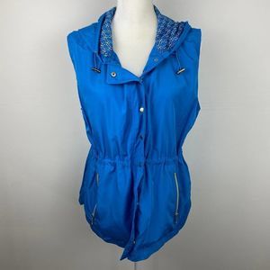 Keren Heart, Blue vest with snaps.